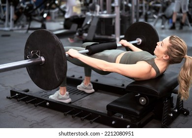 Caucasian woman making workout at the gym