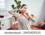 caucasian woman massaging her jaw and face portrait, facial yoga and anti aging concept 