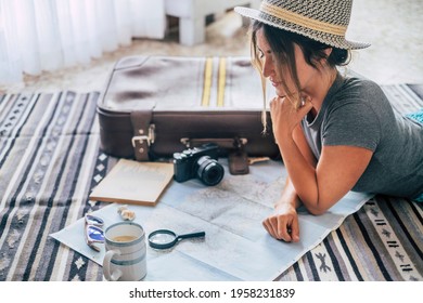 Caucasian Woman Planning Vacation Travel With Map And Guide At Home, Female People Plan Next Holidays Vacation While Relaxing On The Floor - Pretty Girl Wanderlust Concept