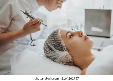 Caucasian woman receiving face oxygen peeling at cosmetology center. Facial skin treatment. Beauty skin. Beauty face. Cosmetology beauty procedure. Skin care.