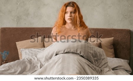 Caucasian woman suddenly wake up abruptly on bed in morning afraid about late time hurry to work hurrying student girl overslept panic lateness waking up sudden nightmare after sleeping alarm clock