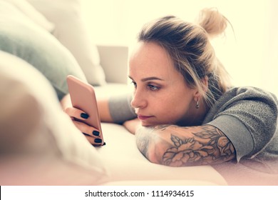 Caucasian woman using mobile phone - Powered by Shutterstock