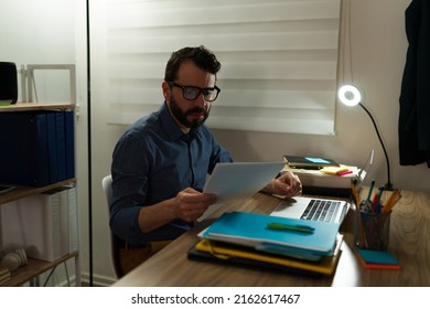 Caucasian Workaholic Man Working Late At Night To Finish Some Business And Analyzing Problems