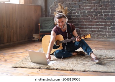 Caucasian Young Adult Learning Guitar Online Music Class With Distant Teacher Computer Mobile Device. Handsome Hipster Man Teaching Music Through Laptop, Distance Education Learning Concept 