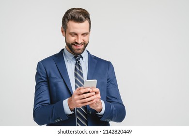 Caucasian young businessman ceo bank worker employee freelancer financial adviser in formalwear using smart phone cellphone for online mobile applications, calls isolated in white