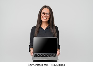 Caucasian young businesswoman freelancer ceo boss bank manager employee using laptop showing screen with blank mockup for e-learning, e-commerce advert isolated in white