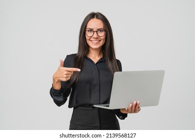 Caucasian young confident businesswoman ceo manager bank employee worker boss having idea startup pointing at laptop for remote work, watching webinars online, multitasking isolated in white - Powered by Shutterstock