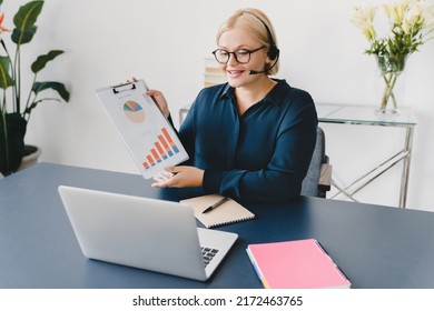 Caucasian Young Student Ceo Teacher Businesswoman Tutor Consulting Clients, E-learning, Tutoring, Showing Charts Online On Laptop On Videocall Conference In Office. Remote Work