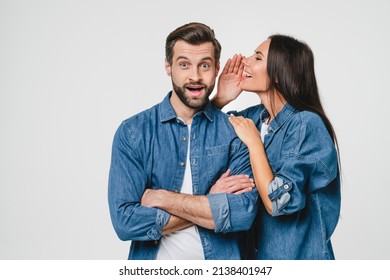 Caucasian Young Wife Girlfriend Whispering In Husband Man Boyfriend Spouse Ear Gossips, Telling Rumors Secrets, Sharing Information Isolated In White Background