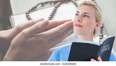Caucasian young woman holding bible while looking away with hands clasped on book in background. spirituality, digital composite, religion, meditation, christianity and national day of prayer.