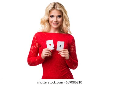 Caucasian young woman with long light blonde hair in evening outfit holding playing cards. Isolated. Poker - Powered by Shutterstock