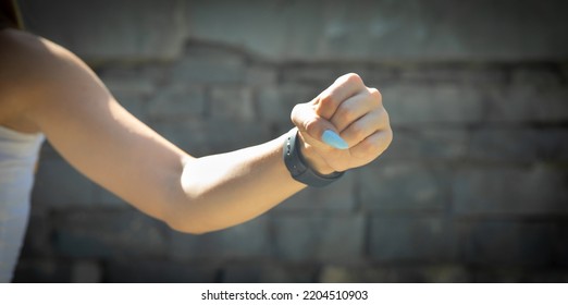 Caucasian Young Woman Threatening With Fist.