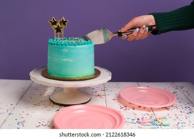 Caucasian Young Woman Using A Cake Cutter To Serve Delicious Cake While Celebrating A Party 