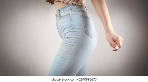 Caucasian Young Woman Wearing Blue Jeans At Home.