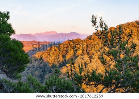 Caucasus Mountains in the rays of the setting sun. View from the Eagle Rocks
