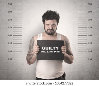 Caught guilty man with ID signs on his hand. - Shutterstock ID 1084277822
