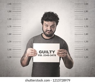 Caught guilty man with ID signs on his hand. - Shutterstock ID 1213728979
