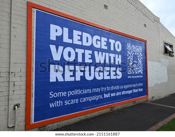 Caulfield\
South, Victoria, Australia - April 30 2022: Sign from the Asylum\
Seeker Resource Centre, or ASRC, calling on voters to consider\
refugees when voting at the federal\
election