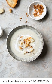 Cauliflower Cream Soup In Bowl With Fried Onion And Parmesan Cheese. Top View.