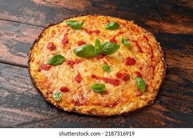 Cauliflower crust pizza with tomato sauce, cheese and basil. Healthy diet food