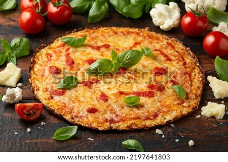 Cauliflower crust pizza with tomato sauce, cheese and basil. Healthy diet food