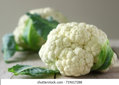 Cauliflower on a wooden background. Rustic style, selective focus.