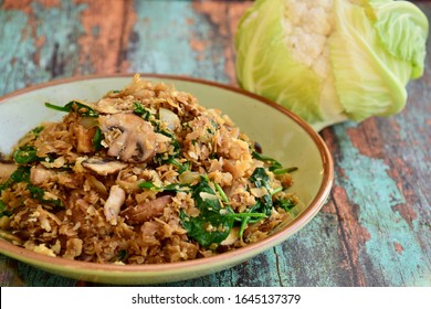 Cauliflower rice with spinach, mushroom and soy sauce. Vegan food