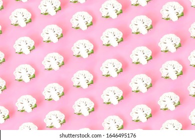 Cauliflower seamless pattern on pink pastel background. Vegetables abstract background, pop art design. Healthy food concept. Top view, flat lay.
