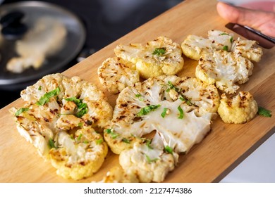 Cauliflower Steaks Cooking. Healthy Eating, Plant Based Meat Substitute Concept. Vegetarian Organic Food.