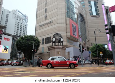 Causeway Bay, Hong Kong, China- March 12, 2017:  Taxi Driving Into Streets Of Downtown Hong Kong Time Square.