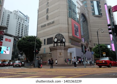 Causeway Bay, Hong Kong, China- March 12, 2017: Taxi Driving Into Streets Of Downtown Hong Kong Time Square. 