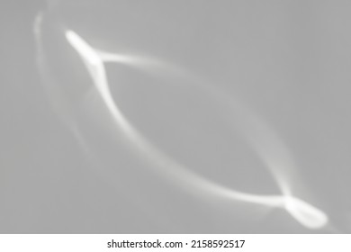Caustic effect light refraction on white wall overlay photo mockup, blurred sun rays refracting through glass prism with shadow. Abstract natural light refraction silhouette on water surface mock up.
