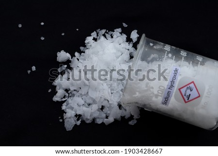 caustic soda flake on black background