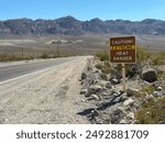 Caution Extreme Heat Danger Sign in Death Valley National Park near Furnace Creek California in July