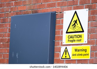 Caution fragile roof sign and anti climb warning