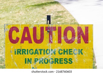 caution irrigation check in progress sign