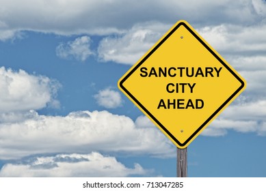 Caution Sign Blue Sky Background - Sanctuary City Ahead