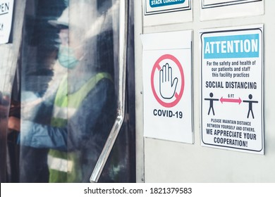 Caution sign in factory warning to industry labor worker to prevent Covid-19 Coronavirus spreading during job business reopening period after epidemic crisis . Working safely concept . - Shutterstock ID 1821379583