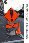 Caution street road sign for event ahead at stadium in capital city of Wellington, New Zealand Aotearoa