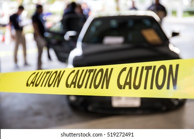 Caution Tape Or Police Line Protect Vehicle In Crime Scene Investigation Training In Academy With Blurred Law Enforcement Background