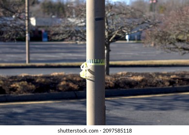 Caution tape tied around lightpole