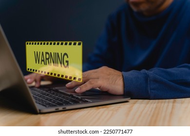 Caution Warning, error notification system and maintenance cyber attacks concept, computer networks Security data connection compromised Laptop computer user with warning triangle warn