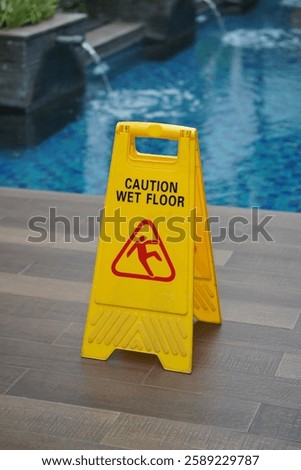 caution wet floor at pool