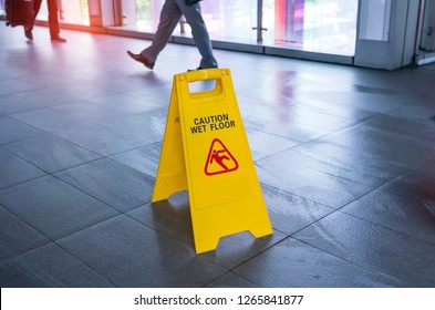 "Caution wet floor" sign - Powered by Shutterstock