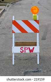 Caution,hazard Saw Horse Sign On Suburban Street