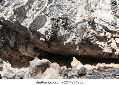 cave entrance into the cliff