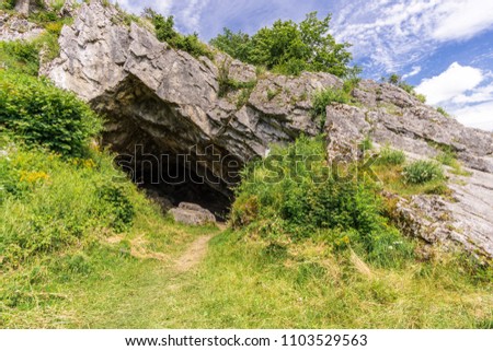 cave entry at summer clouds