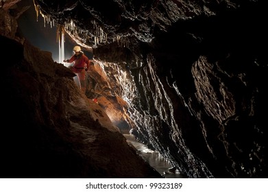 Cave Explorer, Speleologist Exploring The Underground