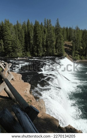 Cave Falls waterfall on Falls River in Yellowstone National Park, Wyoming