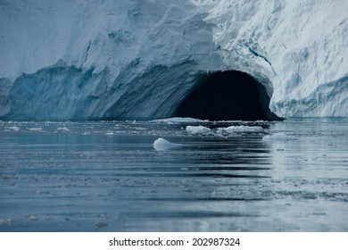 Cave In Ice Cliff In Arctic Ocean